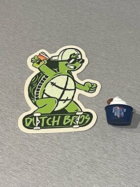 Dutch Bros Green Turtle Skateboard Sticker & Mini Charm Pup Cup